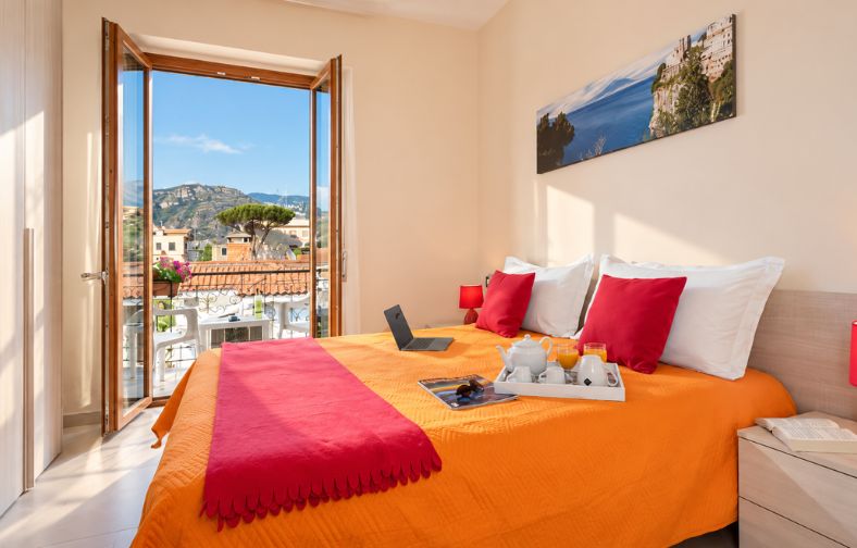 camera da letto mediterranea con vista panoramica cover sorrentohouseexperience myhome